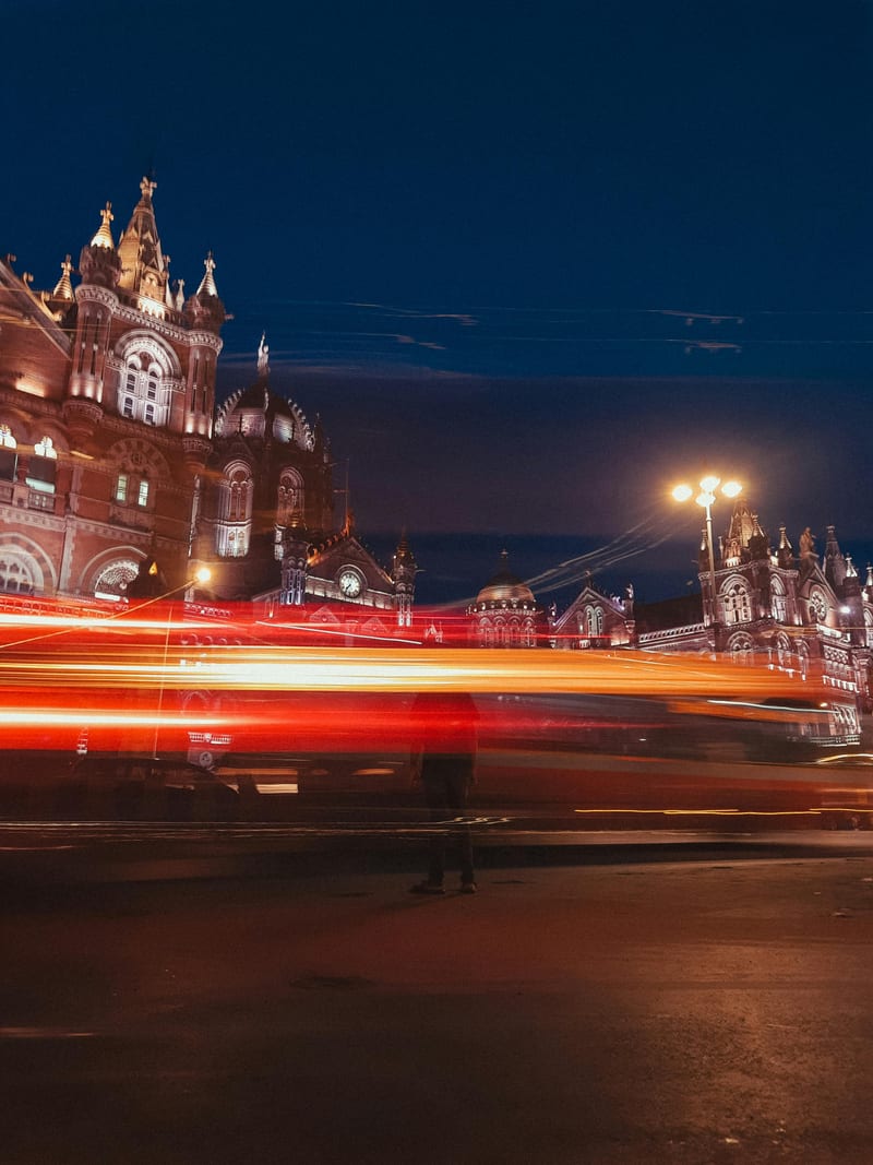 CST station with light trails at night — long-exposure dramatic